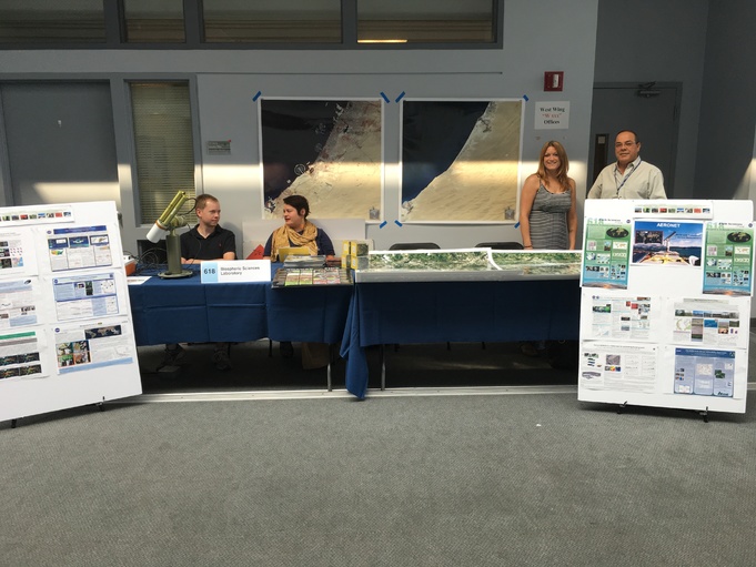 Biospheric Sciences lab 2016 Science Jamboree showing science posters, Landsat before and after land use change and a sun photometer from the AERONET group.