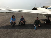 Michelle Hofton, Bryan Blair and David Rabine from the LVIS team cooling off under the B-200 wing.