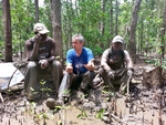 Discussing the issues of sampling in the illegally cut areas. <br>Left to right: Drs. Mwita Mangora (University of Dar Es Salaam), Carl Trettin (USFS), and SeungKuk Lee (NASA/GSFC)
